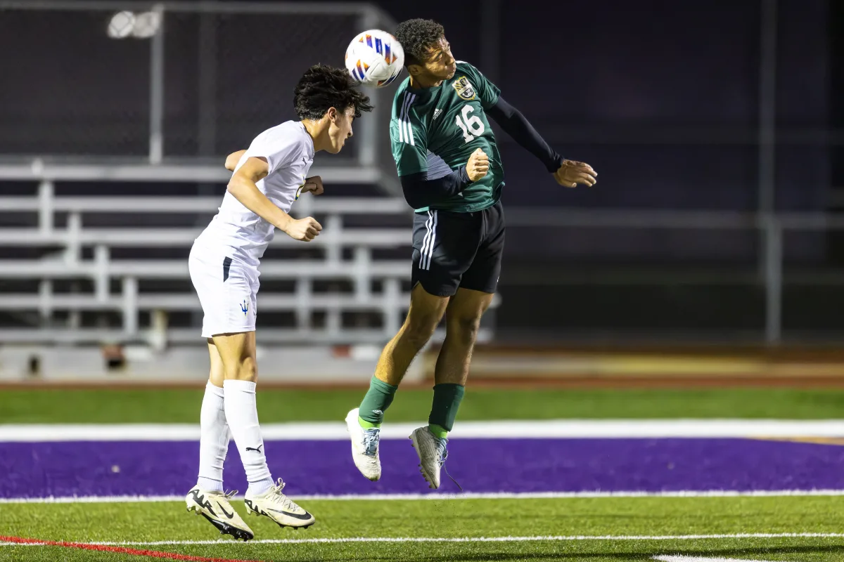 Patriots defender Daniel Pryor '26 battles for the ball with a strong header to his teammates. The team's defense was crucial in pushing the ball away from their own net, and restricted Warren to five shots across the game.