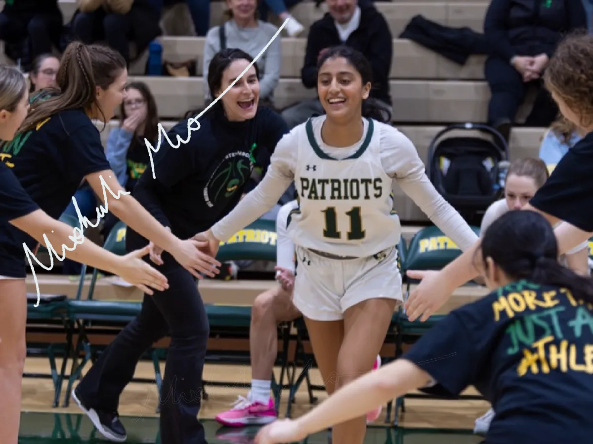 Photo illustration of Nisha Musunuri '25 signature overlayed on image of Musunuri running out before a game.