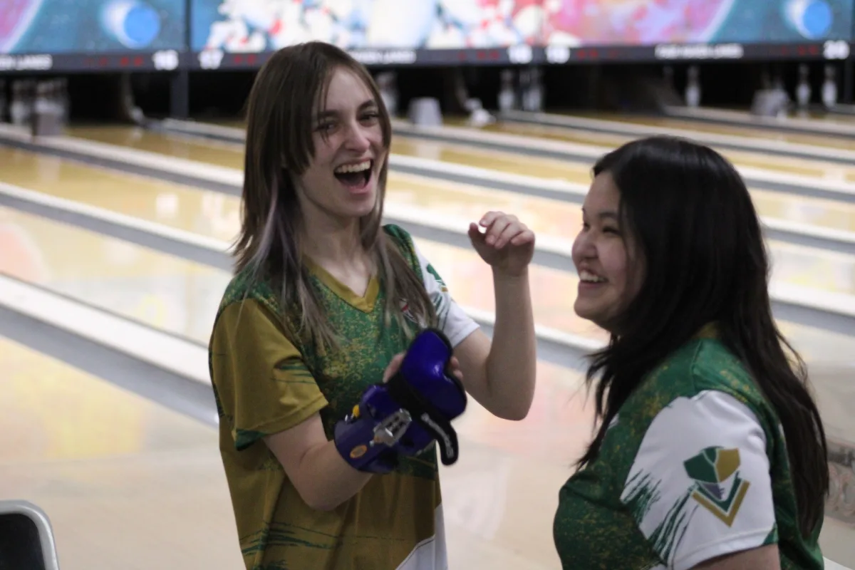  Patriot teammates celebrate with each other following a strike. After last week’s loss against Vernon Hills, the Patriots were able to successfully bounce back this week against Zion-Benton.